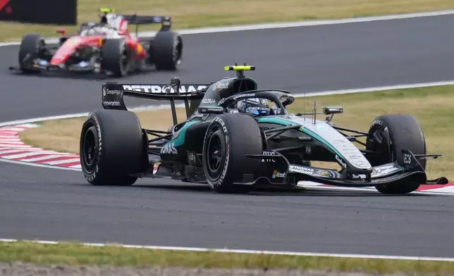 Mercedes driver Kimi Antonelli of Italy steers his car during the Japanese Formula One Grand Prix at Suzuka in central Japan, Sunday, March 29, 2026. (AP Photo/Hiro Komae)