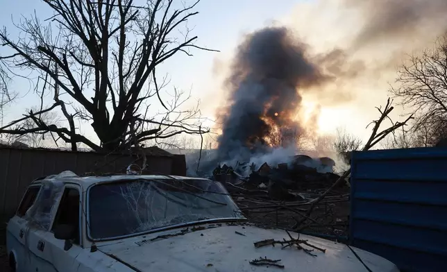A private house burns following Russian aerial guided bomb strike in Zaporizhzhia, Ukraine, Saturday, March 14, 2026. (AP Photo/Kateryna Klochko)