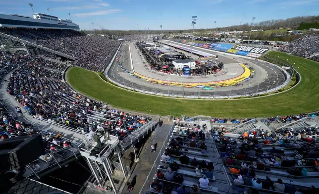 Drivers race through Turn 1 and Turn 2 during a NASCAR Cup Series auto race in Martinsville, Va., Sunday, March 29, 2026. (AP Photo/Chuck Burton)