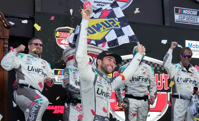 Chase Elliott celebrates in Victory Lane after winning a NASCAR Cup Series auto race in Martinsville, Va., Sunday, March 29, 2026. (AP Photo/Chuck Burton)