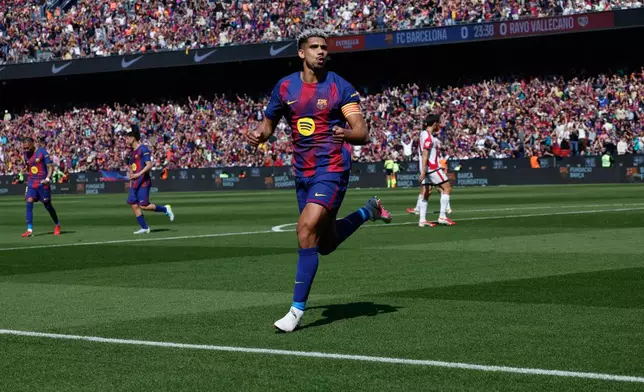 Barcelona's Ronald Araujo celebrates after scoring during a La Liga soccer match between Barcelona and Rayo Vallecano in Barcelona, Spain, Sunday, March 22, 2026. (AP Photo/Joan Monfort)