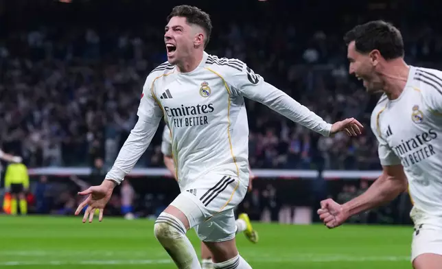 Real Madrid's Federico Valverde celebrates after scoring his side's second goal the Spanish La Liga soccer match between Real Madrid and Atletico Madrid in Madrid, Spain, Sunday, March 22, 2026. (AP Photo/Manu Fernandez)