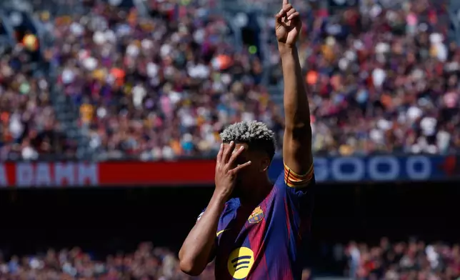 Barcelona's Ronald Araujo celebrates after scoring during a La Liga soccer match between Barcelona and Rayo Vallecano in Barcelona, Spain, Sunday, March 22, 2026. (AP Photo/Joan Monfort)