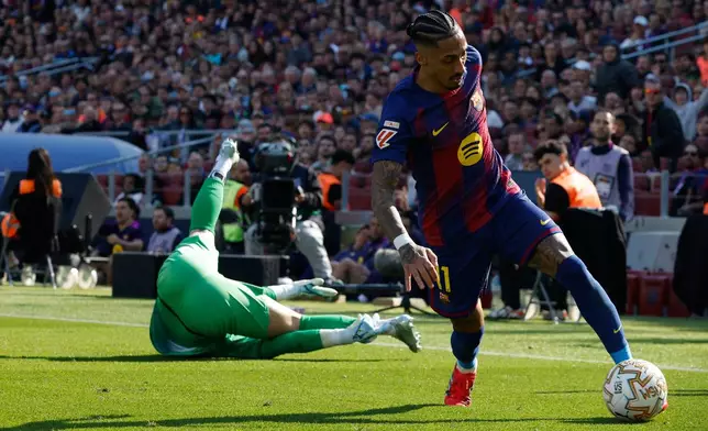 Barcelona's Raphinha in action during a La Liga soccer match between Barcelona and Rayo Vallecano in Barcelona, Spain, Sunday, March 22, 2026. (AP Photo/Joan Monfort)
