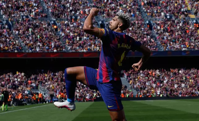 Barcelona's Ronald Araujo celebrates after scoring during a La Liga soccer match between Barcelona and Rayo Vallecano in Barcelona, Spain, Sunday, March 22, 2026. (AP Photo/Joan Monfort)