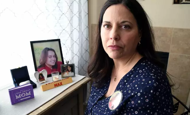 Kim Osterman, who says her son Max died after taking fentanyl he bought from a dealer on Snapchat, poses for a portrait in her living room in Thornton, Colo., Thursday, March 26, 2026. (AP Photo/Thomas Peipert)