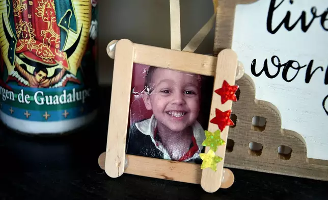 A childhood photo of Max Osterman, whose mother says he died after taking fentanyl he bought from a dealer on Snapchat, is displayed in his mother's living room in Thornton, Colo., on Thursday, March 26, 2026. (AP Photo/Thomas Peipert)