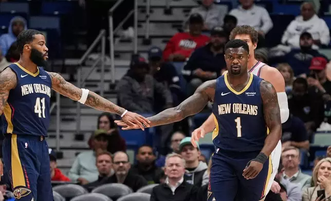 New Orleans Pelicans guard Saddiq Bey (41) congratulates forward Zion Williamson (1) after being fouled going to the basket in the first half of an NBA basketball game against the Los Angeles Clippers, Wednesday, March 18, 2026, in New Orleans. (AP Photo/Gerald Herbert)