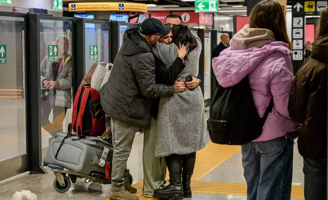 The flight from Abu Dhabi with passengers returned to Italy arrives at Fiumicino Airport, in Rome, Tuesday, March 3, 2026. (Valentina Stefanelli/LaPresse via AP)