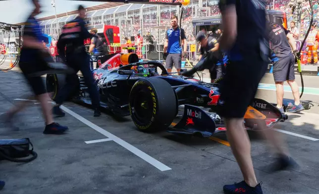 Mechanics work on Red Bull driver Isack Hadjar of France's car during the first practice session for the Australian Formula One Grand Prix at Albert Park, in Melbourne, Australia, Friday, March 6, 2026. (AP Photo/Asanka Brendon Ratnayake)