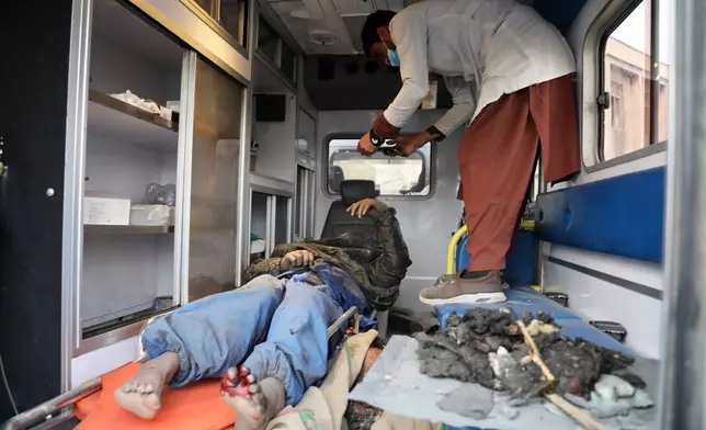 A survivor is treated in an ambulance at the site of a late-Monday airstrike at a drug rehabilitation hospital in Kabul, Afghanistan, Tuesday, March 17, 2026. (AP Photo/Siddiqullah Alizai)