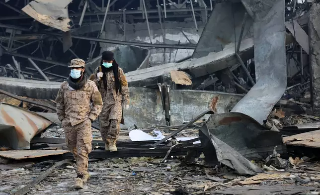 Taliban rescue workers inspect the site of a late-Monday airstrike at a drug rehabilitation hospital in Kabul, Afghanistan, Tuesday, March 17, 2026. (AP Photo/Siddiqullah Alizai)