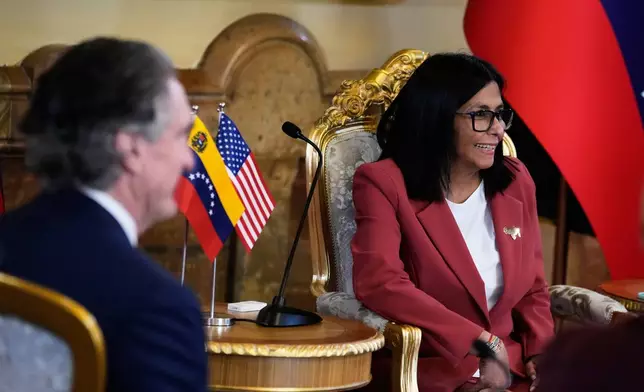 Venezuela's acting President Delcy Rodriguez, right, and U.S. Interior Secretary Doug Burgum meet at Miraflores presidential palace in Caracas, Venezuela, Wednesday, March 4, 2026. (AP Photo/Ariana Cubillos)