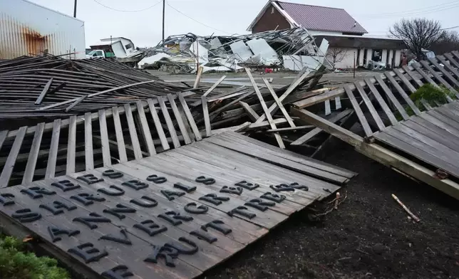 A storm-damaged Tholens' Landscape &amp; Garden center is in ruins in the aftermath of a powerful storm that ripped through the area a day earlier in Kankakee, Ill., Wednesday, March 11, 2026. (AP Photo/Nam Y. Huh)