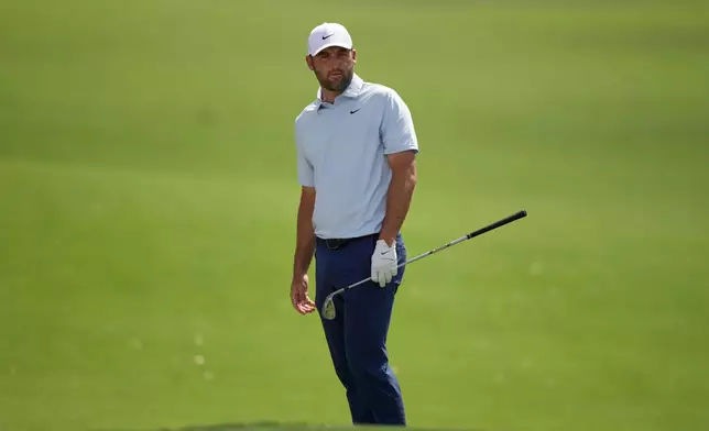 Scottie Scheffler watches his shot land on the first green during the second round of the Arnold Palmer Invitational at Bay Hill golf tournament Friday, March 6, 2026, in Orlando, Fla. (AP Photo/Matt Slocum)