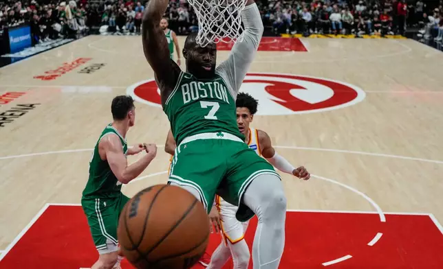 Boston Celtics guard Jaylen Brown (7) dunks against the Atlanta Hawks in the second half of an NBA basketball game, Monday, March 30, 2026, in Atlanta. (AP Photo/Mike Stewart)