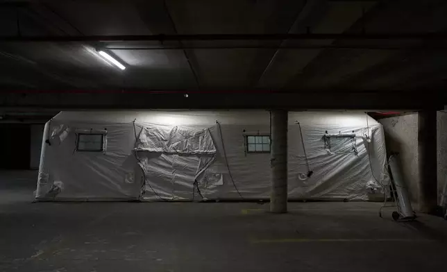 A temporary emergency ward is set up in a parking garage used as a shelter beneath Sheba Medical Center in Ramat Gan, Israel, Tuesday, March 17, 2026. (AP Photo/Oded Balilty)