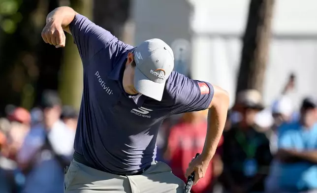 Matt Fitzpatrick celebrates his birdie putt on the 18th hole during the final round of the Valspar Championship golf tournament Sunday, March 22, 2026, in Palm Harbor, Fla. (AP Photo/Jason Behnken)