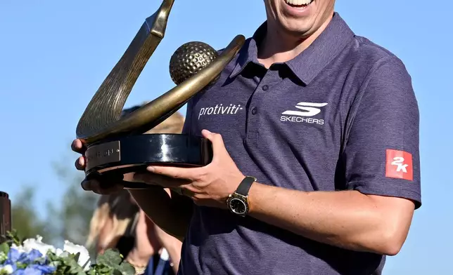 Matt Fitzpatrick celebrates after winning the Valspar Championship golf tournament Sunday, March 22, 2026, in Palm Harbor, Fla. (AP Photo/Jason Behnken)