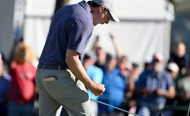 Matt Fitzpatrick celebrates his birdie putt on the 18th hole during the final round of the Valspar Championship golf tournament Sunday, March 22, 2026, in Palm Harbor, Fla. (AP Photo/Jason Behnken)