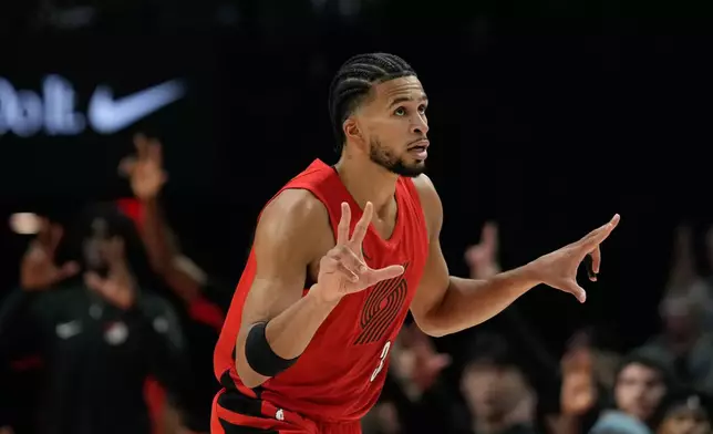 Portland Trail Blazers forward Toumani Camara reacts after shooting a 3-pointer during the first half of an NBA basketball game against the Washington Wizards, Sunday, March 29, 2026, in Portland, Ore. (AP Photo/Jenny Kane)
