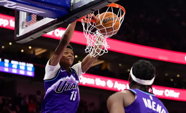 Utah Jazz forward Ace Bailey (19) dunks during the second half of an NBA basketball game against the Washington Wizards, Wednesday, March 25, 2026, in Salt Lake City. (AP Photo/Anna Fuder)