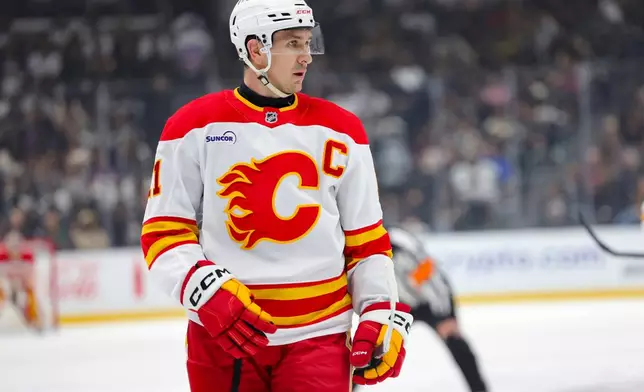 Calgary Flames center Mikael Backlund stands during a face off during the first period of an NHL hockey game against the Los Angeles Kings Saturday, Feb. 28, 2026 in Los Angeles. (AP Photo/Ryan Sun)