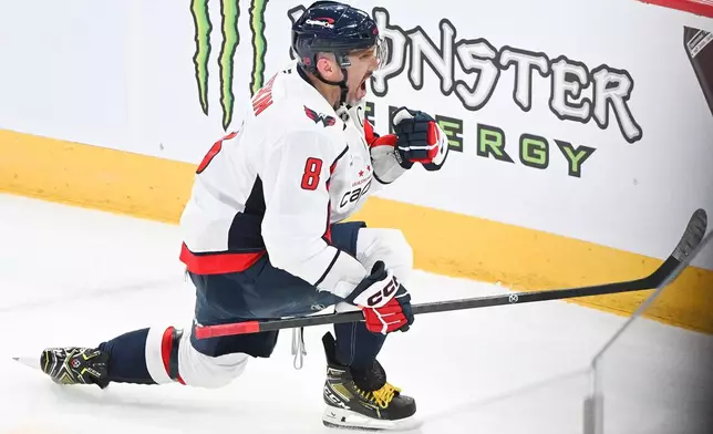 Washington Capitals' Alex Ovechkin (8) reacts after scoring on the Montreal Canadiens during the first period of an NHL hockey game in Montreal, Saturday, Feb. 28, 2026. (Graham Hughes/The Canadian Press via AP)