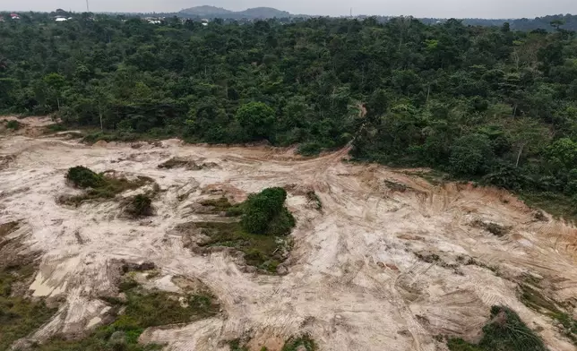 A drone view shows a section of a cocoa farm given over to sand mining in Kona, Ghana, Friday, March 6, 2026. (AP Photo/Tsraha Yaw)