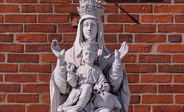 A statue of the Virgin Mary and baby Jesus is displayed outside St. Mary's Church, Tuesday, Feb. 24, 2026, in Cranston, R.I. (AP Photo/Charles Krupa)