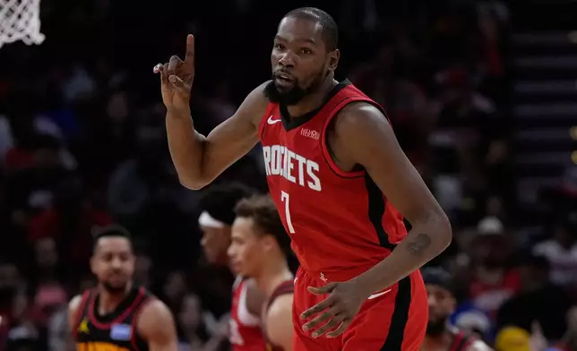 Houston Rockets forward Kevin Durant celebrates after making a shot during the first half of an NBA basketball game against the Atlanta Hawks in Houston, Friday, March 20, 2026. (AP Photo/Ashley Landis)