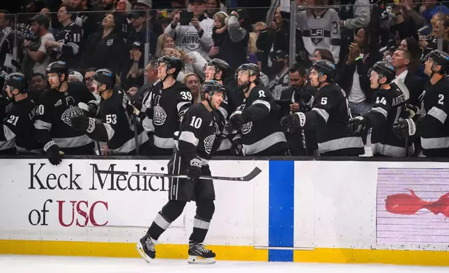 Los Angeles Kings left wing Artemi Panarin (10) greets teammates after scoring during the first period of an NHL hockey game against the Buffalo Sabres, Saturday, March 21, 2026, in Los Angeles. (AP Photo/William Liang)