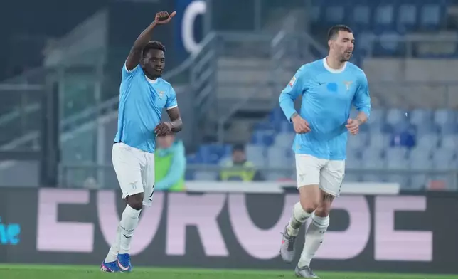 Lazio's Fisayo Dele-Bashiru, left, celebrates after scoring during the Frecciarossa Italian Cup soccer match between Lazio and Atalanta in, Rome, Italy, Wednesday March 4, 2026. (Alfredo Falcone/LaPresse via AP)