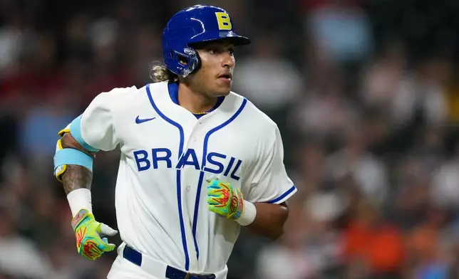 Brazil's Lucas Ramirez runs the bases after hitting a solo home run during the first inning of a World Baseball Classic game, Friday, March 6, 2026, in Houston. (AP Photo/Ashley Landis)
