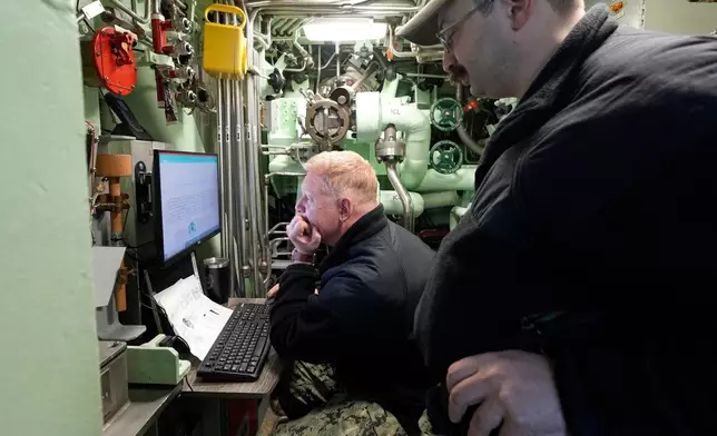Sailors work in the countermeasures department of the Torpedo Room on the USS Massachusetts, the Navy's newest nuclear-powered attack submarine, Friday, March 27, 2026, in Boston. (AP Photo/Robert F. Bukaty)