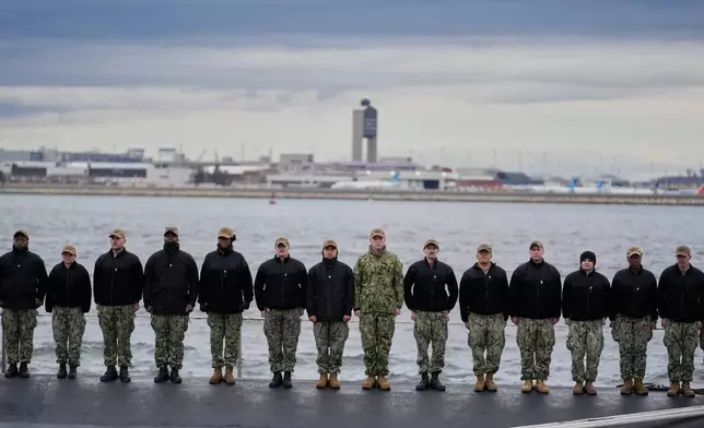 Sailors stand at attention on the USS Massachusetts during a rehearsal ahead of the commissioning of the Navy's newest nuclear-powered attack submarine, Friday, March 27, 2026, in Boston. (AP Photo/Robert F. Bukaty)