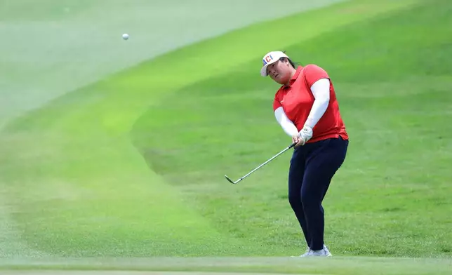 Angel Yin of the United States plays her shot during the HSBC Women's World Championship at Sentosa Golf Club in Singapore, Sunday, March 1, 2026. (AP Photo/Suhaimi Abdullah)