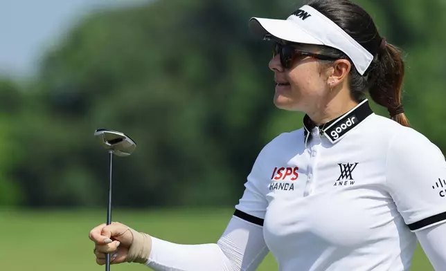 Hannah Green of Australia reacts on the green during the HSBC Women's World Championship at Sentosa Golf Club in Singapore, Sunday, March 1, 2026. (AP Photo/Suhaimi Abdullah)