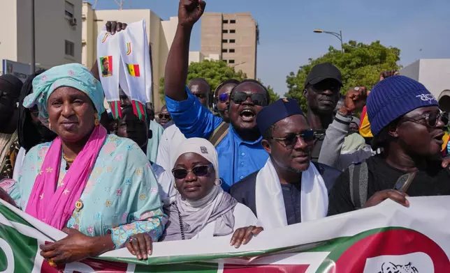 Protesters take to the streets to demonstrate against homosexuality in Dakar, Senegal, Friday, March 6, 2026. (AP Photo/Misper Apawu)