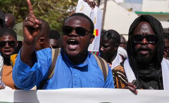 Protesters demonstration against homosexuality in Dakar, Senegal, Friday, March 6, 2026. (AP Photo/Misper Apawu)
