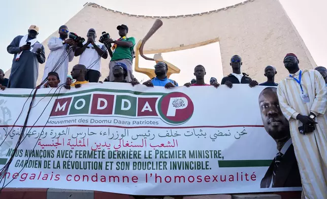 Protesters demonstrate against homosexuality in Dakar, Senegal, Friday, March 6, 2026. (AP Photo/Misper Apawu)