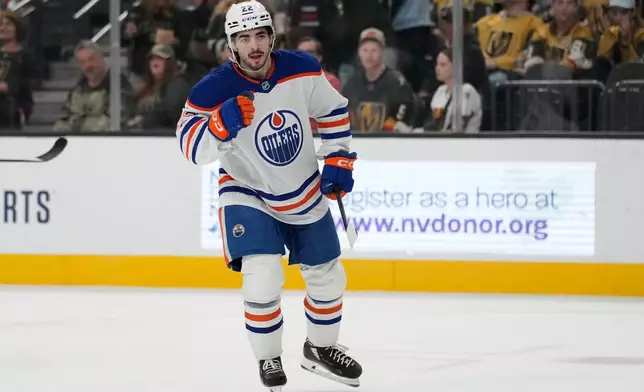 Edmonton Oilers center Matt Savoie (22) celebrates after scoring against the Vegas Golden Knights during the first period of an NHL hockey game Thursday, March 26, 2026, in Las Vegas. (AP Photo/John Locher)