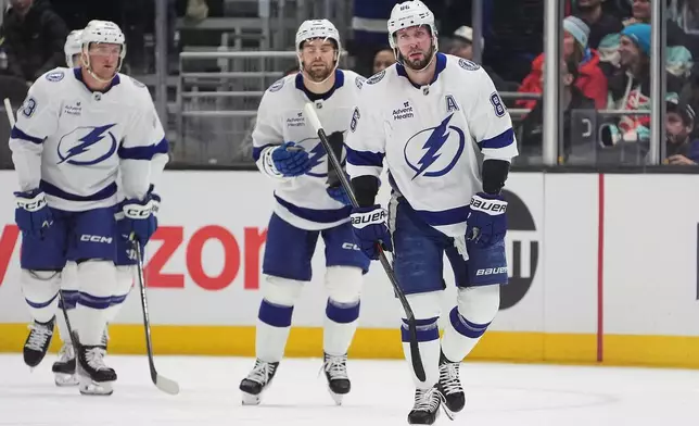 Tampa Bay Lightning right wing Nikita Kucherov skates to greet the bench after scoring against the Seattle Kraken during the first period of an NHL hockey game Tuesday, March 17, 2026, in Seattle. (AP Photo/Lindsey Wasson)