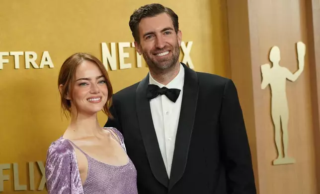 Emma Stone, left, and Dave McCary arrive at the 32nd Annual Actor Awards on Sunday, March 1, 2026, at the Shrine Auditorium and Expo Hall in Los Angeles. (Photo by Jordan Strauss/Invision/AP)