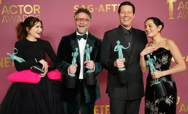 Seth Rogen, second from left, winner of the award for outstanding performance by a male actor in a comedy series for "The Studio," Kathryn Hahn, Ike Barinholtz, and Chase Sui Wonders pose in the press room with the award for outstanding performance by an ensemble in a comedy series for "The Studio" during the 32nd Annual Actor Awards on Sunday, March 1, 2026, at the Shrine Auditorium and Expo Hall in Los Angeles. (Photo by Jordan Strauss/Invision/AP)