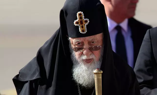 FILE - Georgian Orthodox Patriarch Ilia II, listens to the national anthem during a welcoming ceremony for Pope Francis in Tbilisi, Georgia, Sept. 30, 2016. (AP Photo/Ivan Sekretarev, File)