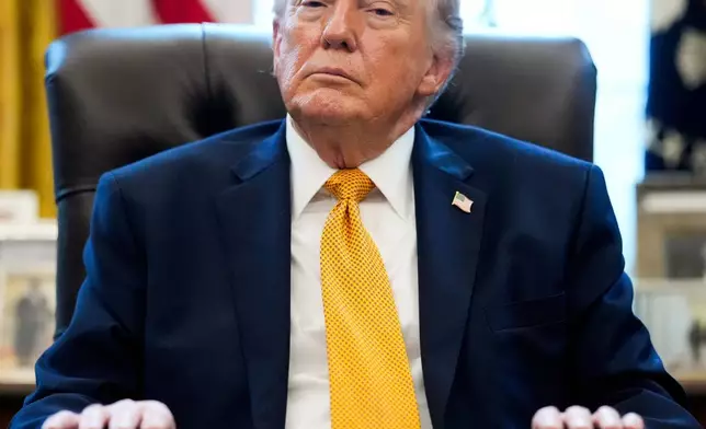 President Donald Trump pauses after signing an executive order in the Oval Office of the White House, Monday, March 16, 2026, in Washington. (AP Photo/Julia Demaree Nikhinson)