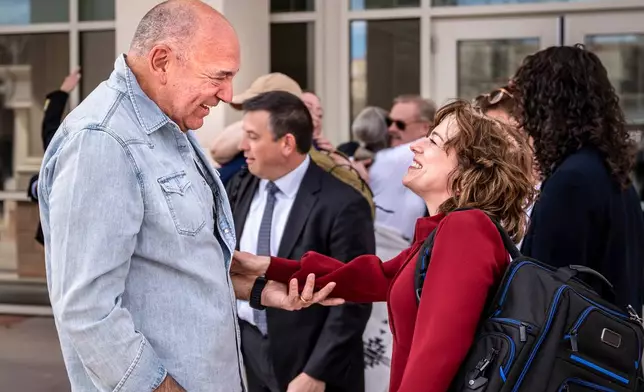 Linda Singer, an attorney representing the state, and Donald Migliori, attorney with the law firm MotleyRice celebrate after the jury reached a verdict against Meta for violated state consumer protection laws and ordering the social media company to pay $375 million in damages to the state, Tuesday, March 24, 2026, in Santa Fe, N.M. (Nathan Burton/Santa Fe New Mexican via AP, Pool)
