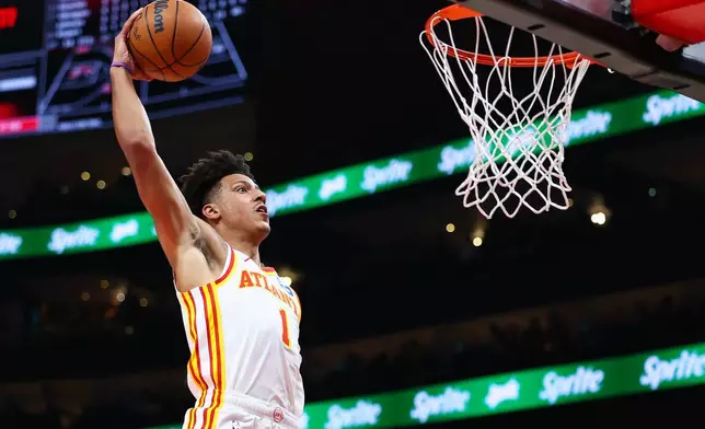 Atlanta Hawks forward Jalen Johnson gets ready to dunk during the first half of an NBA basketball game against the Brooklyn Nets, Thursday, March 12, 2026, in Atlanta. (AP Photo/Colin Hubbard)