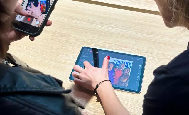 Members of the media try out the new iPad Air during an Apple unveil event, Wednesday, March 4, 2026, in New York (AP Photo/Ted Shaffrey) ,